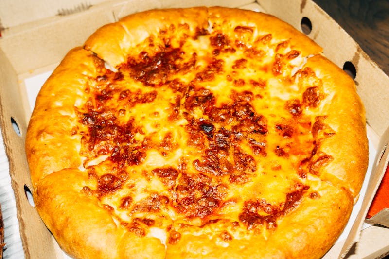 Four cheese blend pizza with golden crust